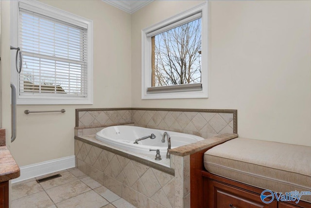 bathroom with a relaxing tiled tub, tile patterned floors, and vanity