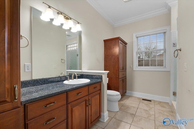 bathroom featuring toilet, vanity, ornamental molding, and tile patterned flooring