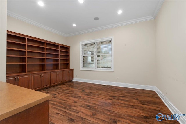 unfurnished office with dark hardwood / wood-style floors and ornamental molding