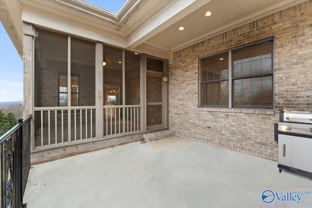 view of patio / terrace with grilling area and a balcony