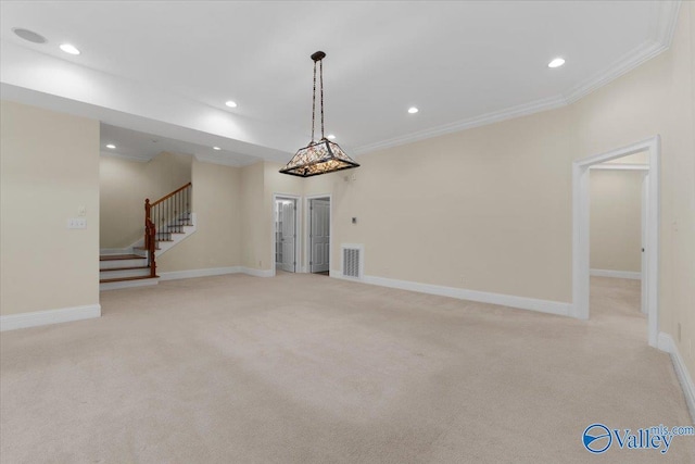 unfurnished living room featuring light carpet and crown molding