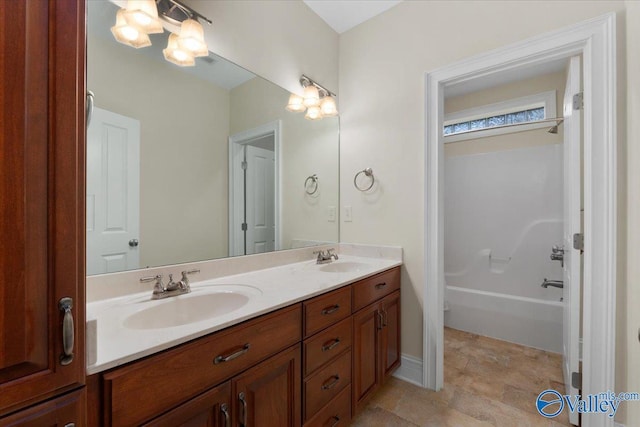 bathroom featuring shower / bath combination and vanity