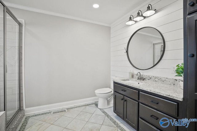 bathroom featuring a stall shower, baseboards, visible vents, and ornamental molding