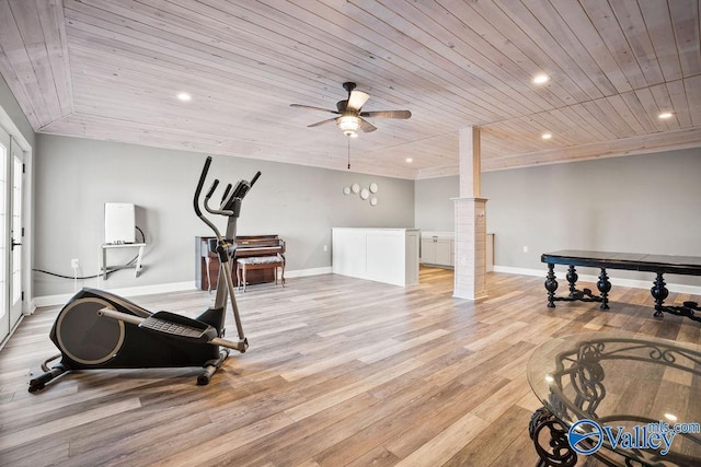 exercise area with light wood-style floors, recessed lighting, wood ceiling, and baseboards