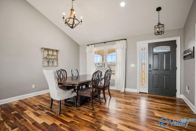 dining room with a chandelier, high vaulted ceiling, baseboards, and dark wood-style floors