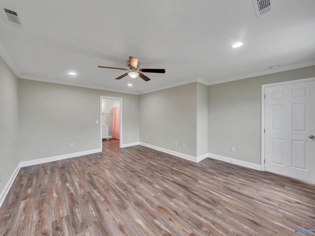 unfurnished room featuring baseboards, ceiling fan, visible vents, and wood finished floors