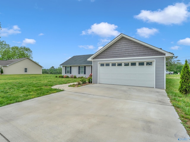 single story home featuring driveway, a front yard, and a garage