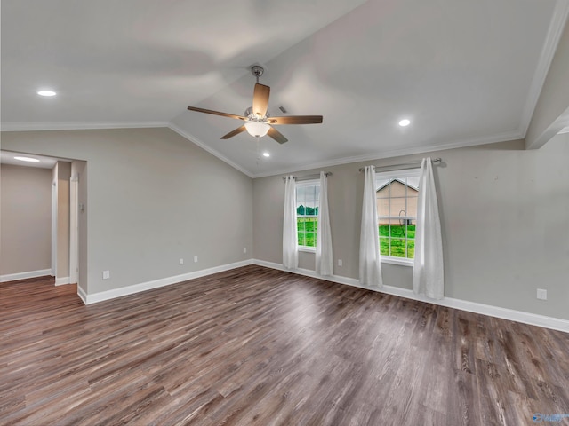 empty room with crown molding, ceiling fan, baseboards, wood finished floors, and lofted ceiling