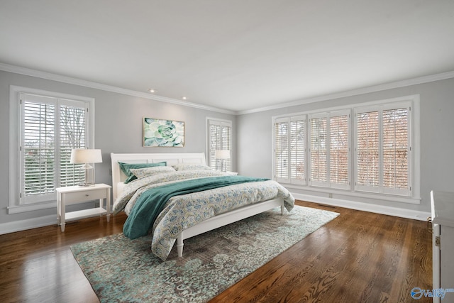 bedroom featuring baseboards, visible vents, ornamental molding, and wood finished floors