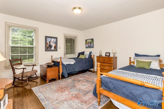 bedroom with wood finished floors