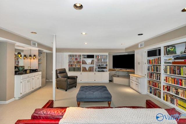 living area with recessed lighting, light colored carpet, and visible vents