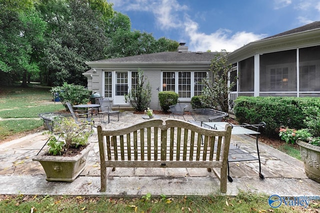 view of patio featuring a sunroom and area for grilling