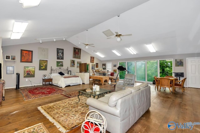 living room with vaulted ceiling, ceiling fan, and wood-type flooring