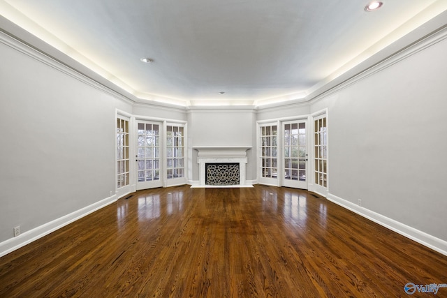 unfurnished living room with a fireplace, baseboards, wood finished floors, and recessed lighting