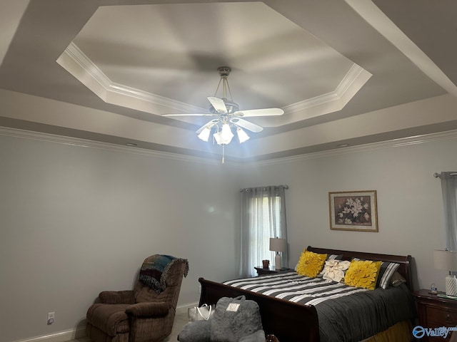 bedroom featuring crown molding, a ceiling fan, and a raised ceiling