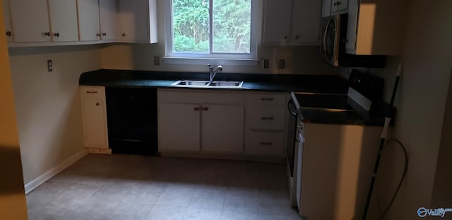 kitchen with range with electric cooktop, white cabinetry, black dishwasher, and sink