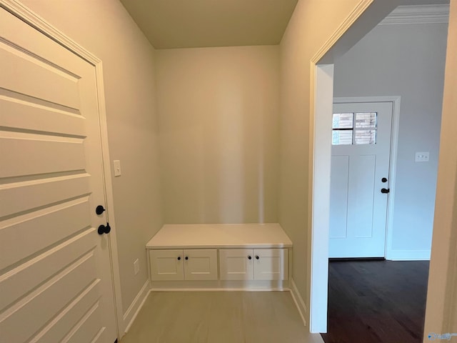 mudroom with baseboards and wood finished floors