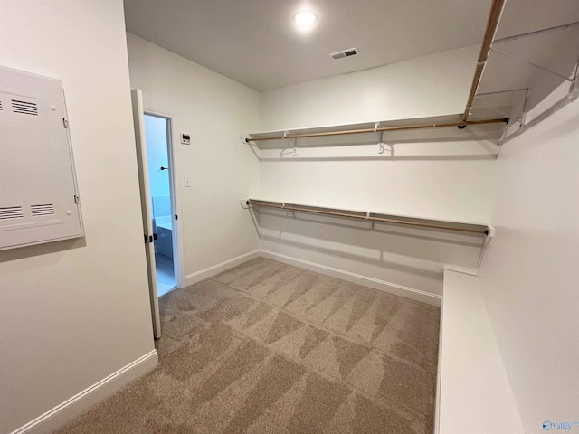 walk in closet with carpet floors and visible vents