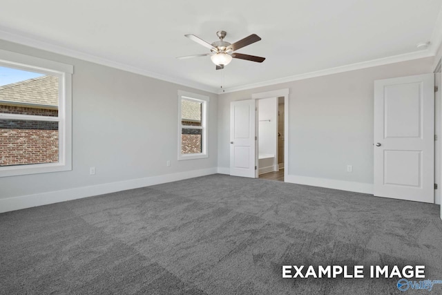 unfurnished bedroom featuring baseboards, carpet floors, a ceiling fan, and crown molding