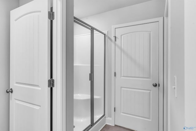 full bathroom with a shower stall
