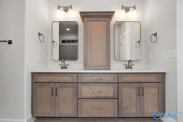 full bath featuring double vanity and a sink