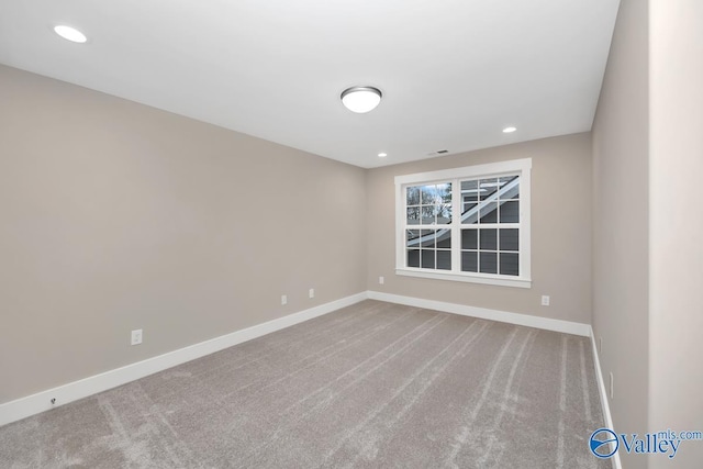 unfurnished room with recessed lighting, visible vents, baseboards, and carpet flooring