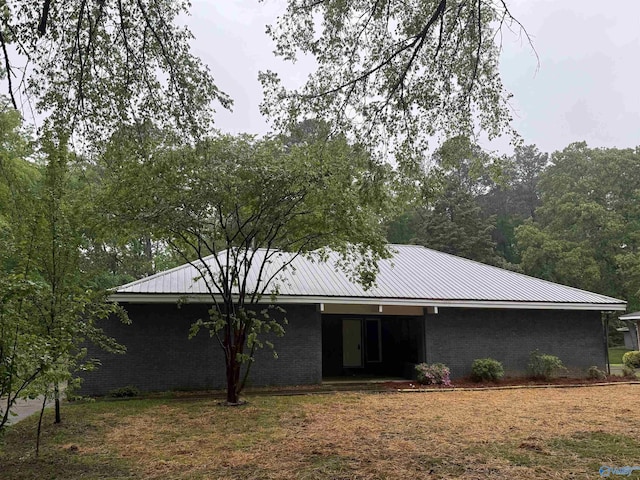 508 Mary St, Centre, AL 35960 - back of house featuring brick siding and metal roof