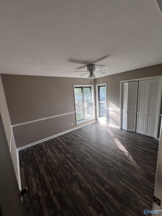 508 Mary St, Centre, AL 35960 - unfurnished bedroom with dark wood-style flooring, a ceiling fan, baseboards, visible vents, and a closet