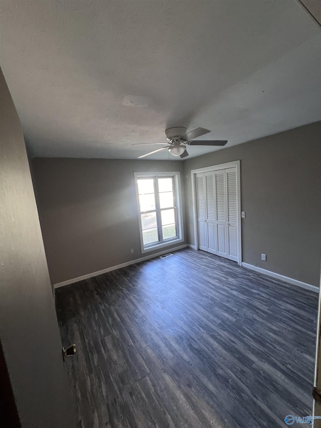 508 Mary St, Centre, AL 35960 - unfurnished bedroom featuring baseboards, a ceiling fan, dark wood-style flooring, and visible vents