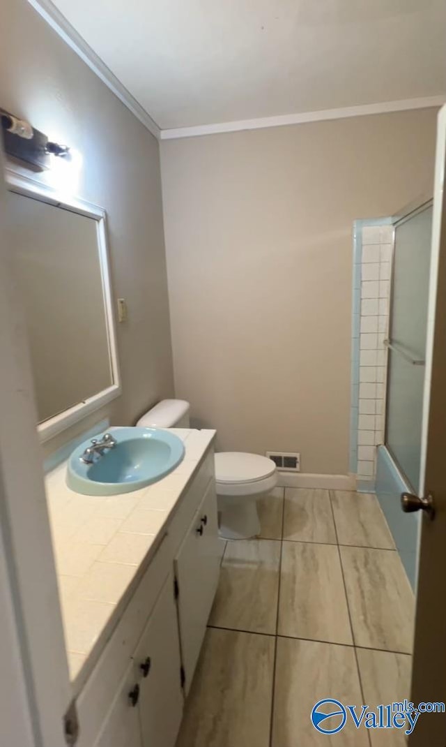 508 Mary St, Centre, AL 35960 - bathroom with visible vents, tile patterned flooring, vanity, toilet, and ornamental molding