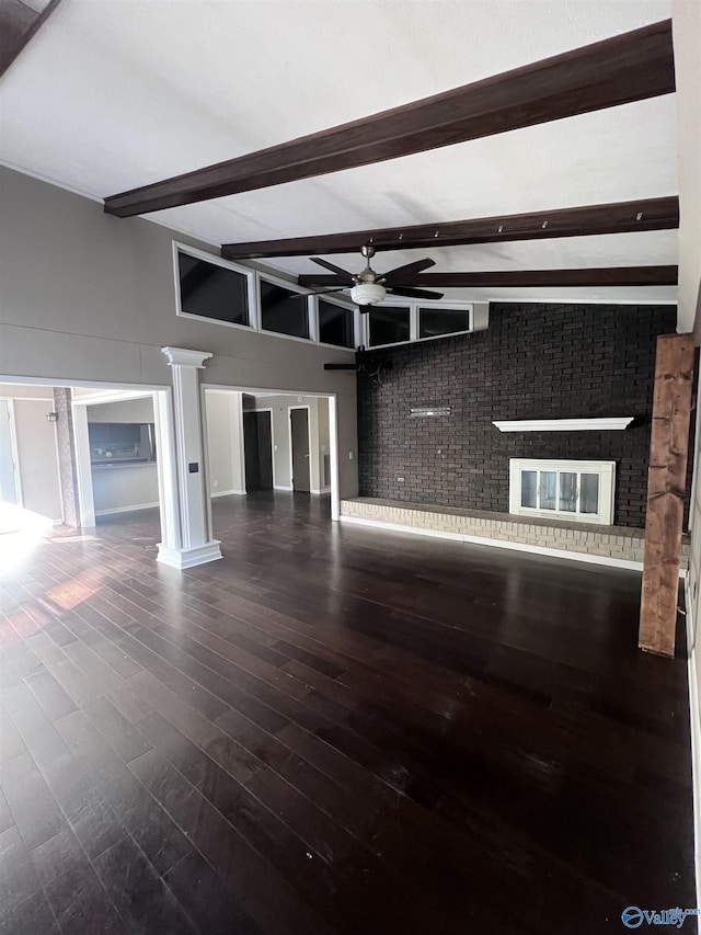 508 Mary St, Centre, AL 35960 - unfurnished living room with a ceiling fan, decorative columns, beam ceiling, and wood finished floors