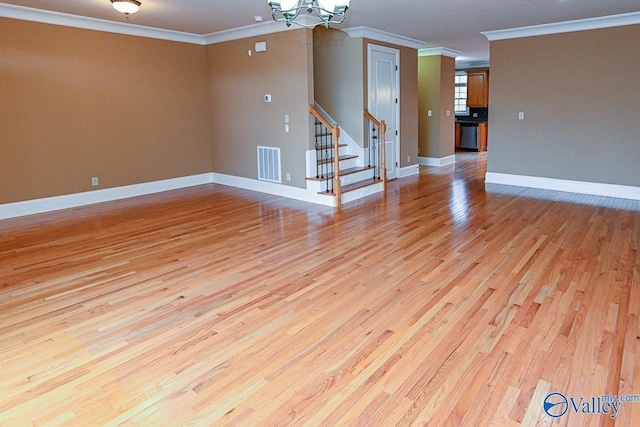 unfurnished living room with ornamental molding, a chandelier, and light hardwood / wood-style floors