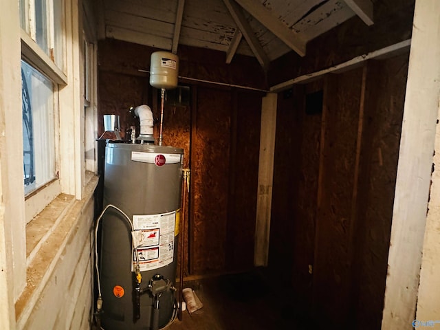 utility room featuring water heater