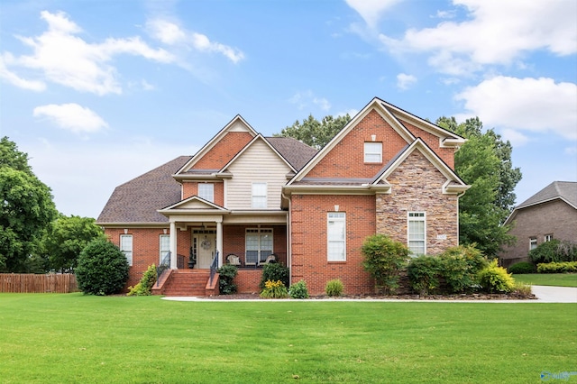 23245 Piney Creek Dr, Athens, AL 35613 - view of front facade with a porch, brick siding, and stone siding