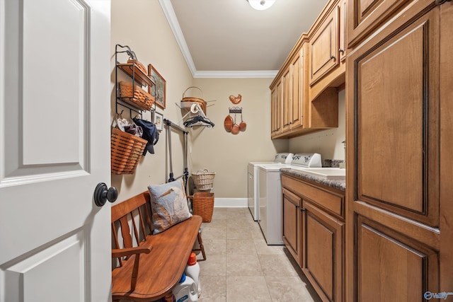 23245 Piney Creek Dr, Athens, AL 35613 - laundry area featuring ornamental molding, cabinet space, independent washer and dryer, light tile patterned floors, and baseboards