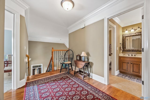 23245 Piney Creek Dr, Athens, AL 35613 - corridor with crown molding, an upstairs landing, light wood finished floors, and baseboards