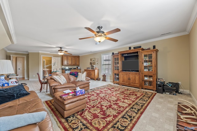 23245 Piney Creek Dr, Athens, AL 35613 - living area featuring ceiling fan, baseboards, ornamental molding, and light colored carpet