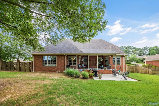 23245 Piney Creek Dr, Athens, AL 35613 - back of property with a patio area and brick siding