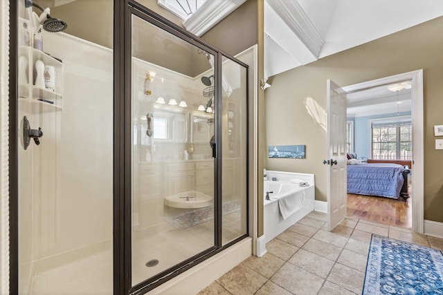 23245 Piney Creek Dr, Athens, AL 35613 - ensuite bathroom with a garden tub, a shower stall, tile patterned flooring, and baseboards