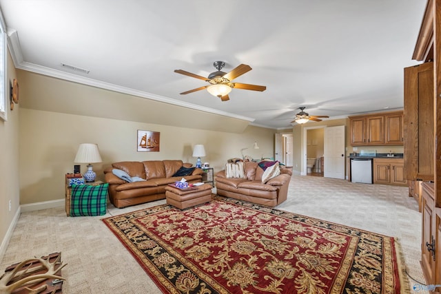 23245 Piney Creek Dr, Athens, AL 35613 - living area featuring light carpet, crown molding, a ceiling fan, and baseboards