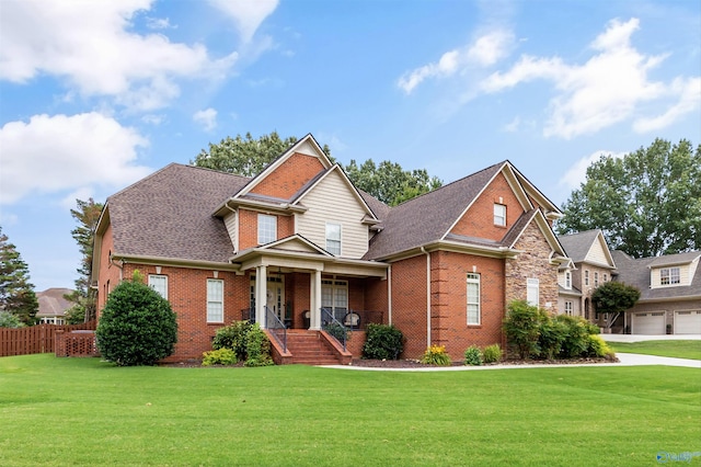 23245 Piney Creek Dr, Athens, AL 35613 - view of front of property featuring brick siding, covered porch, a garage, and a shingled roof