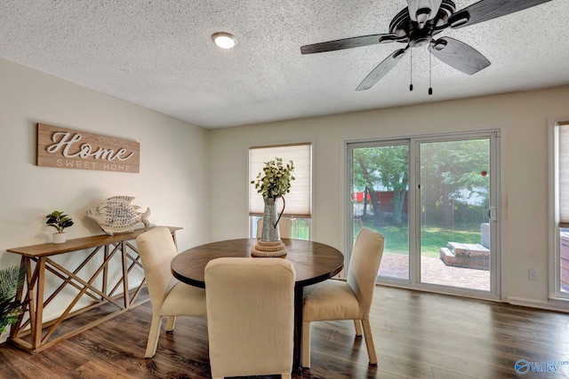 dining room with a textured ceiling, hardwood / wood-style flooring, and ceiling fan