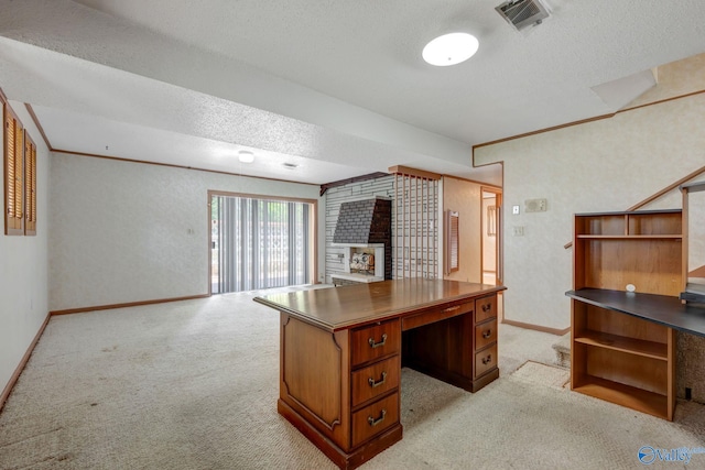 office space featuring light colored carpet and a textured ceiling