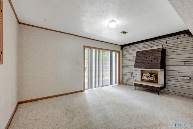 unfurnished room featuring carpet flooring, crown molding, and a textured ceiling