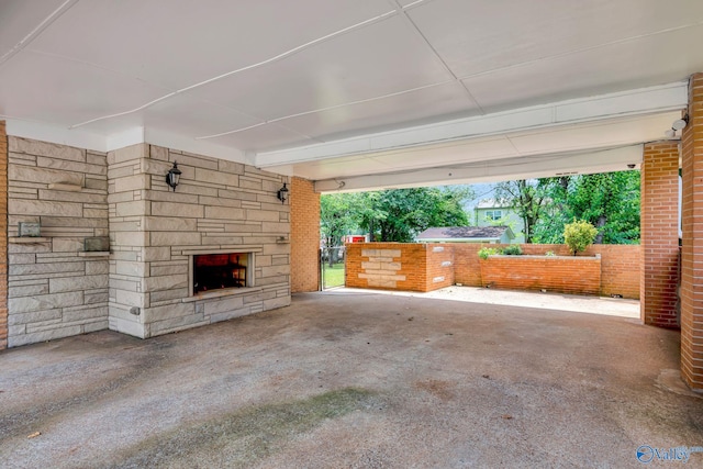 exterior space with an outdoor stone fireplace