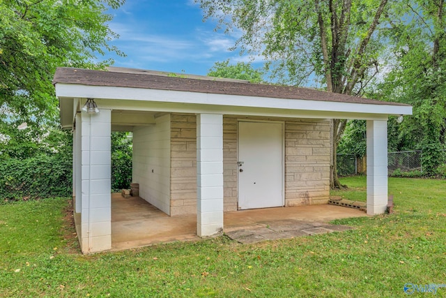 view of outbuilding with a lawn