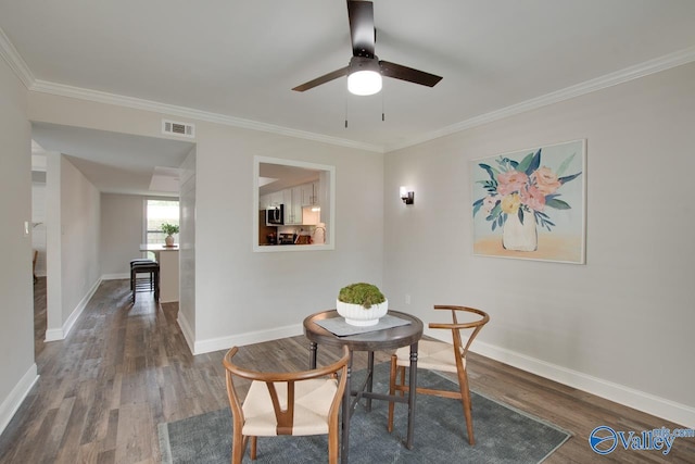 1908 Spanish Oaks Dr SE, Huntsville, AL 35803 - dining space featuring wood finished floors, a ceiling fan, and crown molding