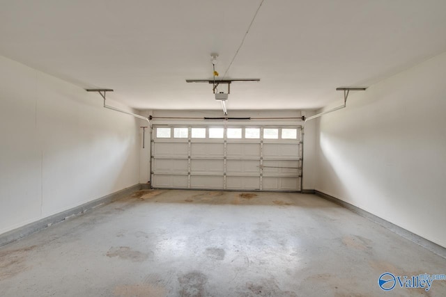 1908 Spanish Oaks Dr SE, Huntsville, AL 35803 - garage with a garage door opener and baseboards