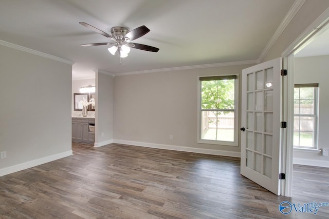 1908 Spanish Oaks Dr SE, Huntsville, AL 35803 - spare room featuring healthy amount of natural light, a ceiling fan, wood finished floors, and ornamental molding