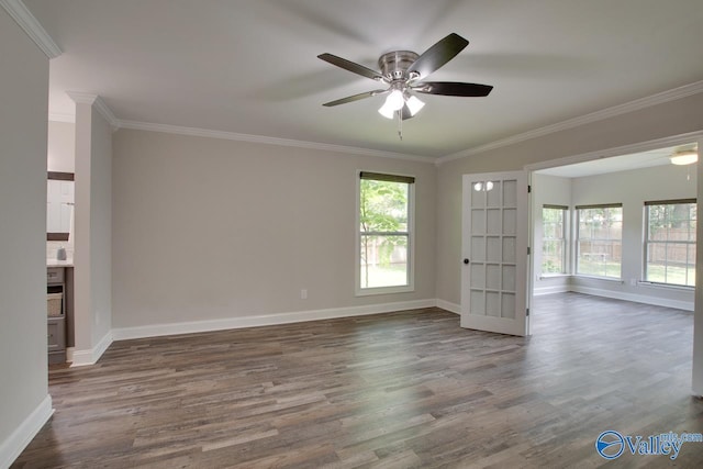 1908 Spanish Oaks Dr SE, Huntsville, AL 35803 - empty room with plenty of natural light, crown molding, wood finished floors, and a ceiling fan